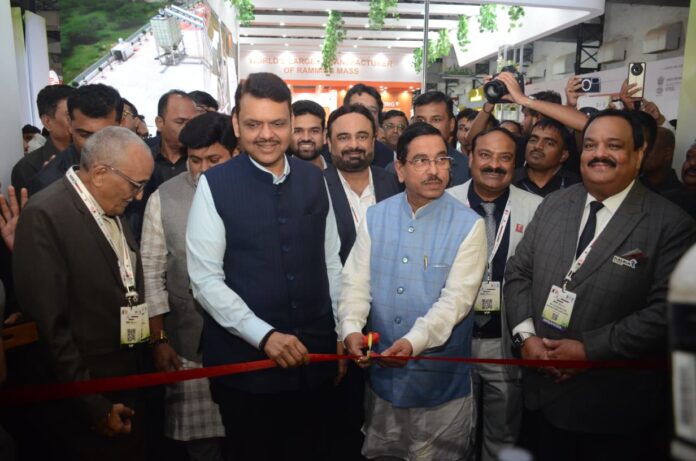Maharashtra Kicks Off Green Steel Revolution at AIIFA Steelex 2025 Maharashtra Chief Minister Devendra Fadnavis and Union Minister Pralhad Joshi at the inauguration of AIIFA Steelex 2025, cutting a red ribbon to open the event in Mumbai.
