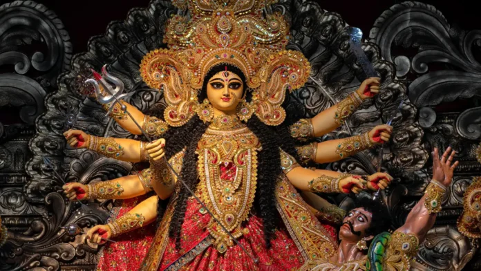 Goddess Durga Idol – Triumph of Good Over Evil During Durga Puja Idol of Goddess Durga with ten arms defeating Mahishasura during Durga Puja festival