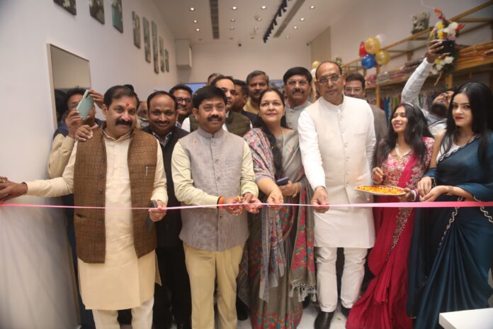 UP Industrial Development Minister Nand Gopal Gupta ‘Nandi’ performing the ribbon-cutting ceremony at the grand expansion of Premji Sarees & Suits in Spectrum Mall, Noida.