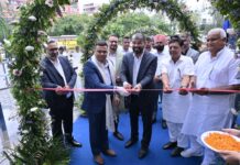 VinFast Opens 3rd Showroom in Jaipur | Sikar Road Sudipta Ghosh, Sitaram Yadav, and Vikas Yadav cutting ribbon at VinFast Velocity Sikar Road Jaipur showroom inauguration